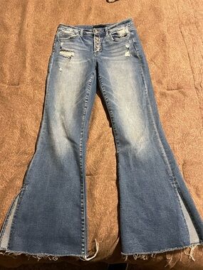 Women’s Flared Distressed Jeans in Medium Blue button front flying monkey slit